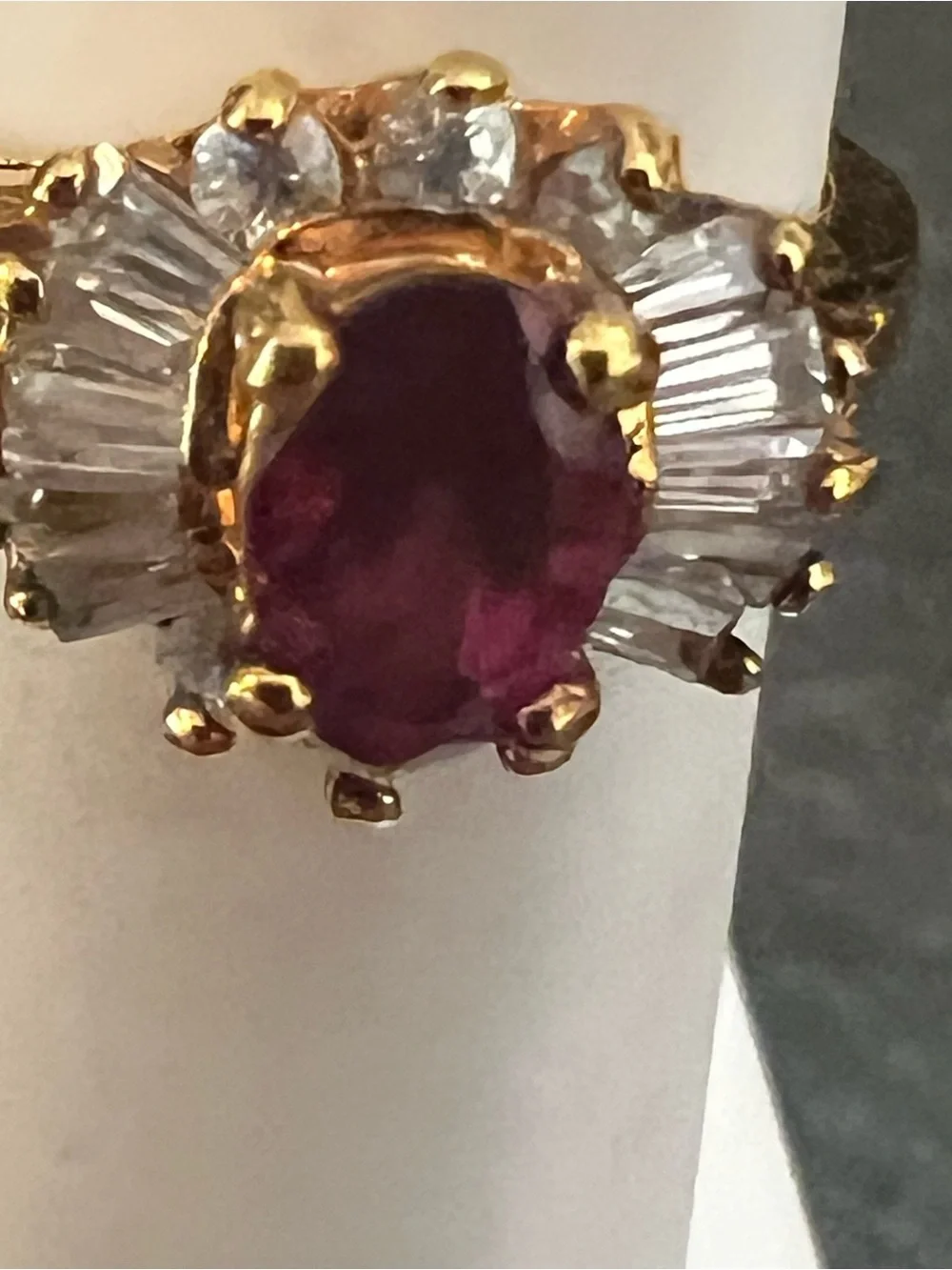 Gold Ring with Ruby-Red Center and Clear Accent Stones